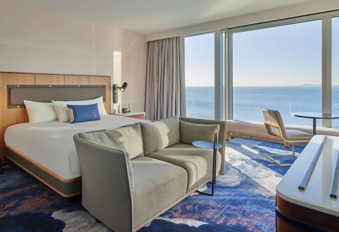 Sable at Navy Pier Chicago, a gay-friendly Curio Collection by Hilton hotel. Room interior with a view of Lake Michigan.