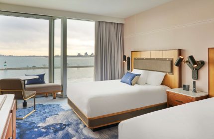 Sable at Navy Pier Chicago, Curio Collection by Hilton guest room. Gay-friendly hotel with waterfront views. Modern design, two beds.