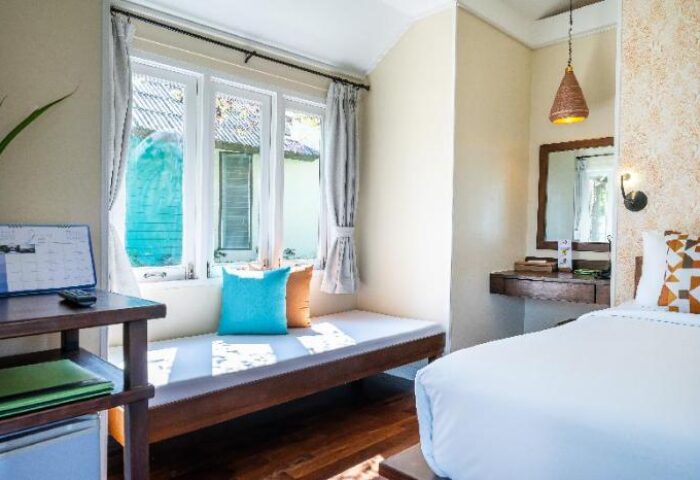 Sai Kaew Beach Resort gay-friendly hotel room. Daybed by window, desk, bed. Ideal for LGBTQ+ travelers seeking comfort in Thailand.