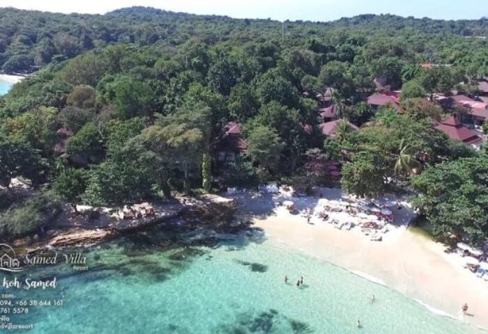 Aerial view of Samed Villa Resort, a gay-friendly hotel on Koh Samed. Lush greenery meets the turquoise sea and sandy beach, perfect for gay travelers.