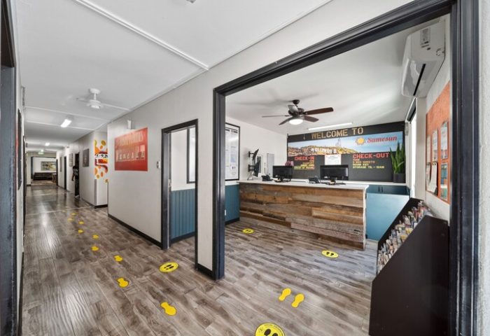 Samesun Hollywood lobby. Gay-friendly hotel (formerly Walk of Fame Hostel) interior. Check-in area with social distancing markers.