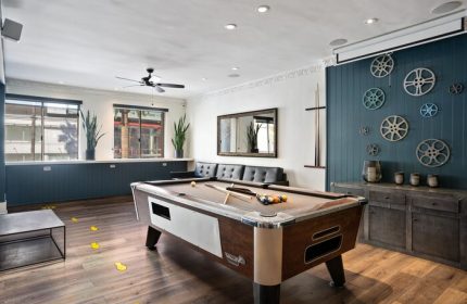 Samesun Hollywood, formerly Walk of Fame Hostel, game room. Pool table, seating, and movie reel decor. Gay-friendly hotel for gay men travelers.