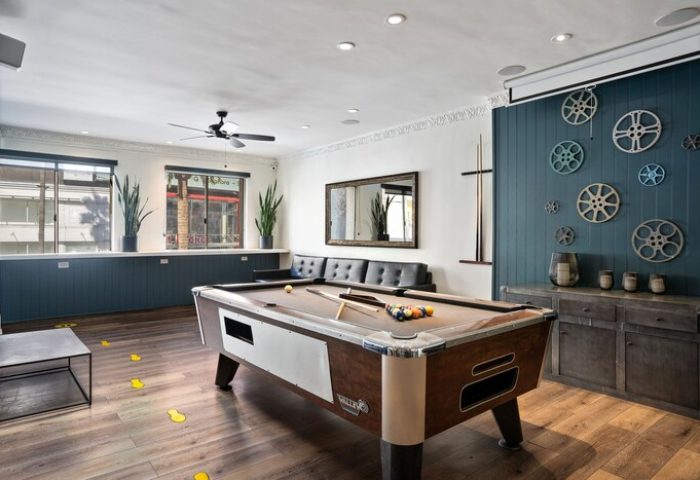 Samesun Hollywood, formerly Walk of Fame Hostel, game room. Pool table, seating, and movie reel decor. Gay-friendly hotel for gay men travelers.