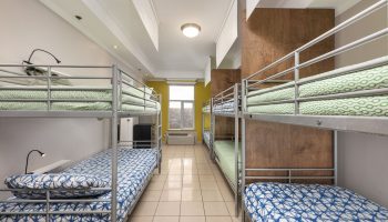 Samesun Montreal Central gay-friendly hotel dorm room with bunk beds. Budget travel lodging for gay men in Montreal. Hostel accommodation.