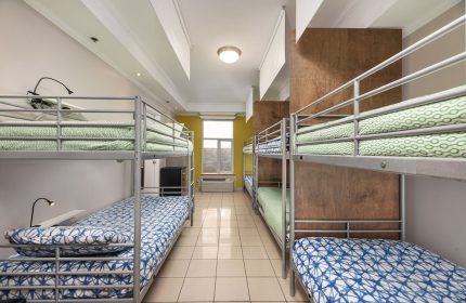 Samesun Montreal Central gay-friendly hotel dorm room with bunk beds. Budget travel lodging for gay men in Montreal. Hostel accommodation.