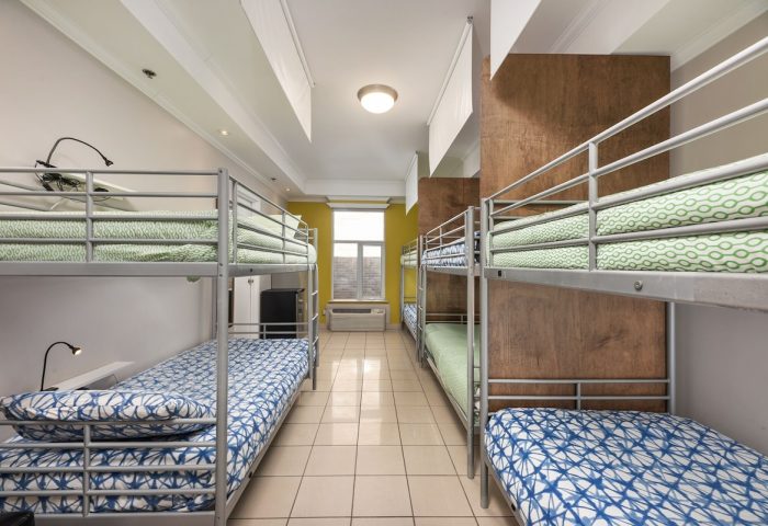 Samesun Montreal Central gay-friendly hotel dorm room with bunk beds. Budget travel lodging for gay men in Montreal. Hostel accommodation.