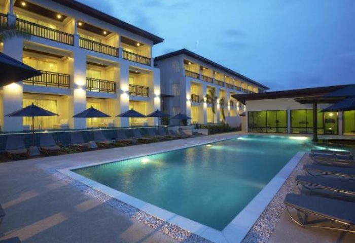 Samui Resotel Beach Resort pool at dusk. This gay-friendly hotel in Samui offers a relaxing and luxurious vacation experience for gay travelers.
