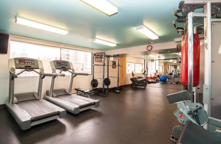 Gym at the gay-friendly Sandman Suites Vancouver Davie Street hotel. Treadmills, weights, and punching bag for a complete workout.