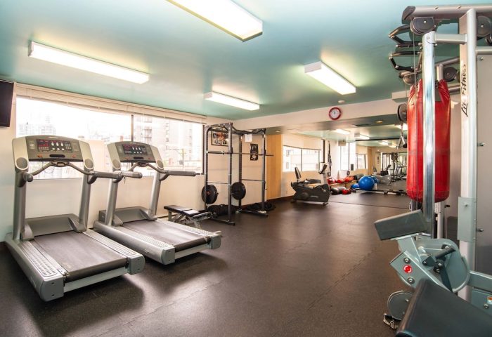 Gym at the gay-friendly Sandman Suites Vancouver Davie Street hotel. Treadmills, weights, and punching bag for a complete workout.
