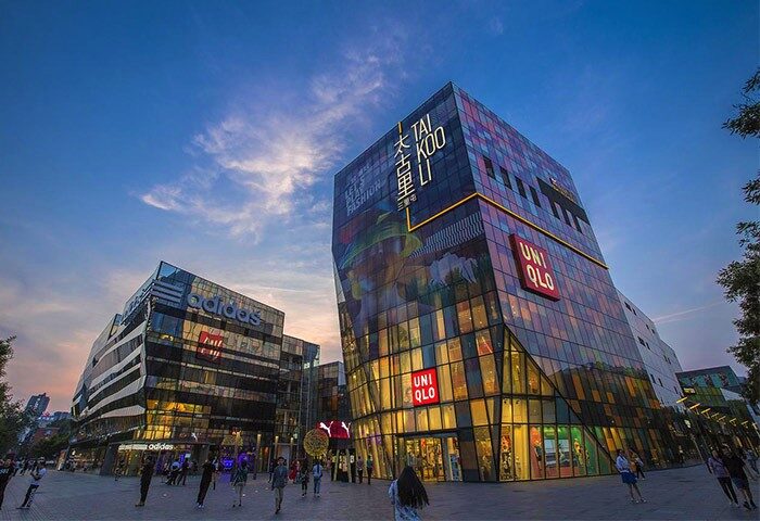 Sanlitun, Beijing. Modern architecture of Tai Koo Li, near a gay-friendly Mark Jacobs Boutique Hotel. Adidas and Uniqlo stores visible.
