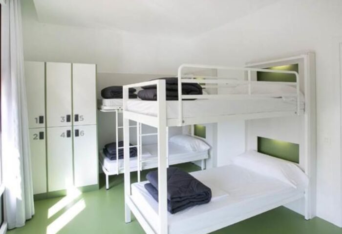 Sant Jordi Hostels Rock Palace gay-friendly hotel dorm room. Bunk beds, lockers. Modern, clean hostel for gay men in Barcelona.