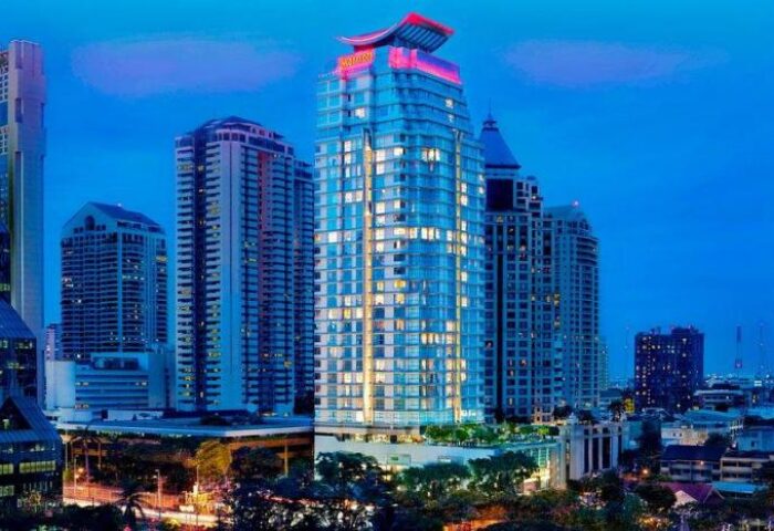 Sathorn Vista, Bangkok - Marriott Executive Apartments, a gay-friendly, pet-friendly hotel with city views at dusk.