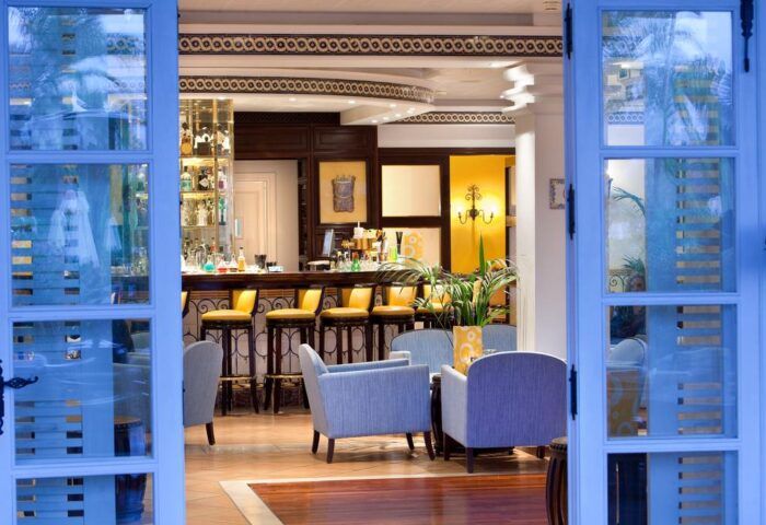 Seaside Grand Hotel Residencia Gran Lujo bar area. Gay-friendly hotel with a stylish bar, seating, and a wide selection of drinks.