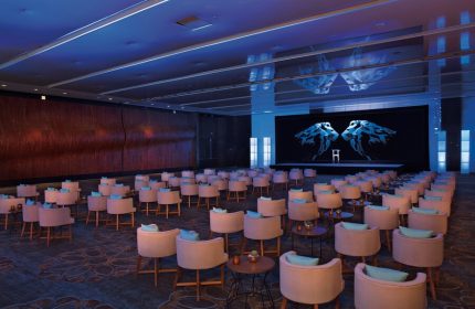Conference room at Secrets The Vine Cancun Resort & Spa, an all-inclusive, adults-only, gay-friendly hotel. Seating arranged for a presentation.