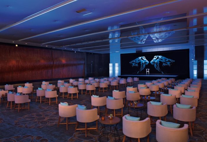Conference room at Secrets The Vine Cancun Resort & Spa, an all-inclusive, adults-only, gay-friendly hotel. Seating arranged for a presentation.