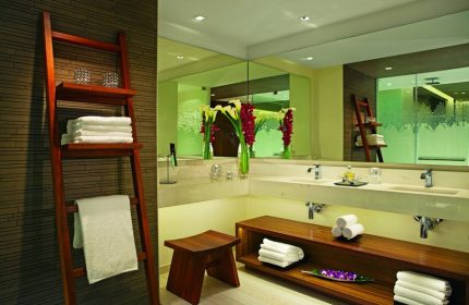 Secrets The Vine Cancun Resort & Spa bathroom. Gay-friendly, all-inclusive, adults-only hotel. Ladder with towels. Modern design.