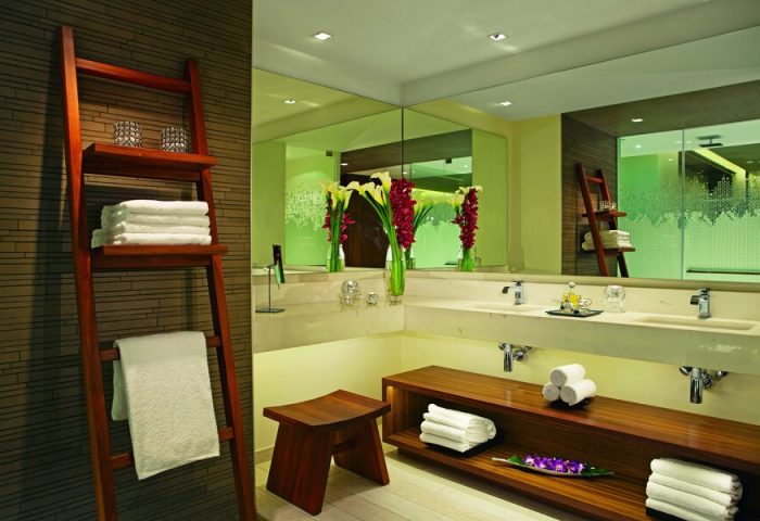 Secrets The Vine Cancun Resort & Spa bathroom. Gay-friendly, all-inclusive, adults-only hotel. Ladder with towels. Modern design.