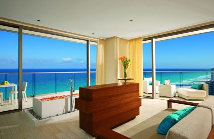 Secrets The Vine Cancun Resort & Spa luxurious suite. Ocean view from balcony with tub. All-inclusive, adults-only, gay-friendly hotel.