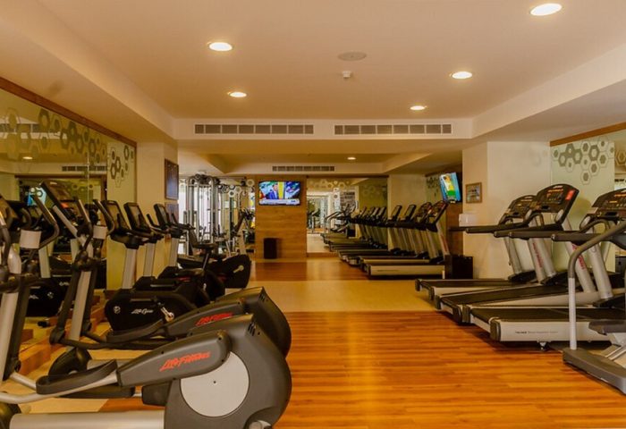 Secrets Vallarta Bay Resort gym. All-inclusive, adults-only, gay-friendly hotel fitness center with treadmills and elliptical machines.