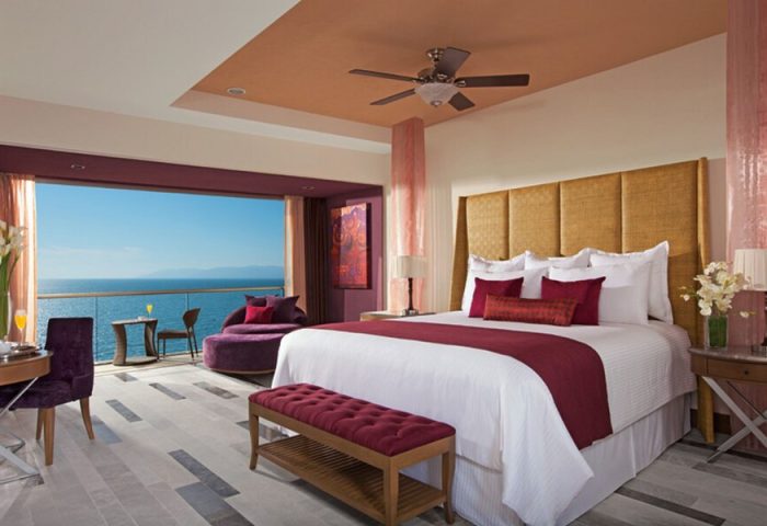 Secrets Vallarta Bay Resort all-inclusive adults-only room. Ocean view from gay-friendly hotel balcony. Luxury travel for gay men.