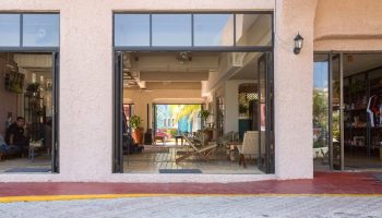 Selina Cancun Laguna Hotel Zone's entrance. Gay-friendly hotel with open doors to a stylish lobby. Inviting space for LGBTQ+ travelers.