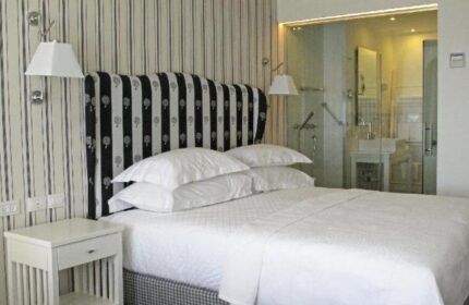 Shalom Hotel & Relax, an Atlas Boutique Hotel room. Gay-friendly, pet-friendly hotel bedroom with ensuite bathroom. Modern design.