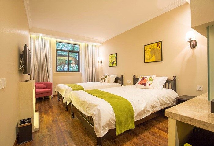 Shanghai Soho Garden Hotel room. Gay-friendly hotel with twin beds, wood floors, & modern decor. A comfortable stay for gay travelers.