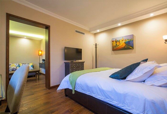 Shanghai Soho Garden Hotel room. Gay-friendly hotel with bedroom, TV, and seating area. A great choice for gay travelers in Shanghai.