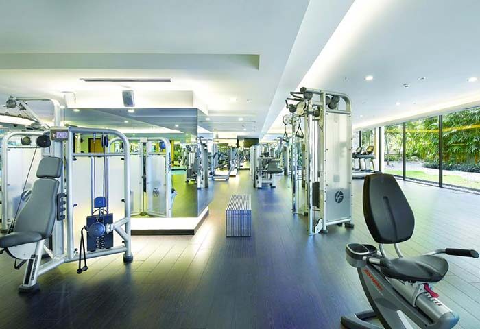 Gay-friendly Shangri-La Hotel Kuala Lumpur gym. Modern fitness center with weight machines, cardio equipment, and natural light.