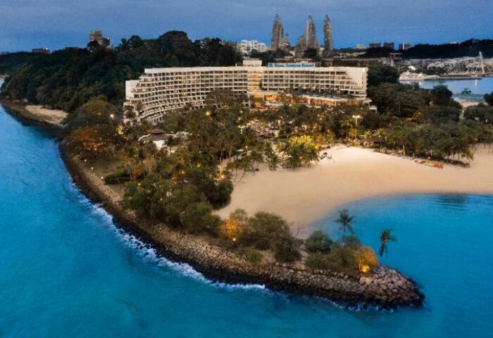 Shangri-La's Rasa Sentosa Resort & Spa, a gay-friendly hotel. Beachfront view of the resort, offering spa services, and a relaxing getaway.