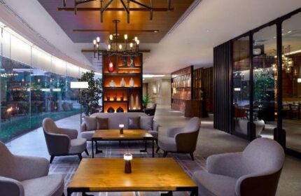 Shangri-La Hotel Jakarta lobby lounge area. Gay-friendly hotel with modern design, comfortable seating, and stylish lighting. Perfect for gay travelers.