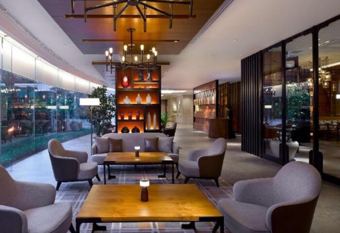 Shangri-La Hotel Jakarta lobby lounge area. Gay-friendly hotel with modern design, comfortable seating, and stylish lighting. Perfect for gay travelers.