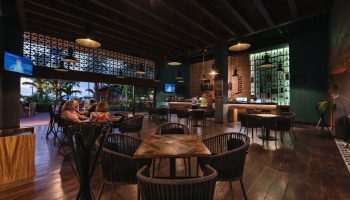 Sheraton Buganvilias Resort bar area. Gay-friendly hotel with indoor/outdoor seating, TV, and fully stocked bar. Perfect for gay travelers.