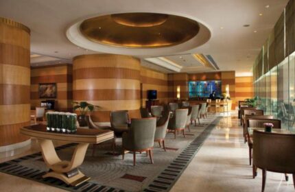 Sheraton Manila Bay, Gay-Friendly Hotel: Elegant lobby lounge with seating, bar, and stylish design. A welcoming space for gay travelers.