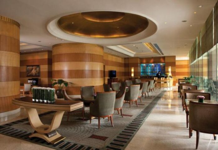 Sheraton Manila Bay, Gay-Friendly Hotel: Elegant lobby lounge with seating, bar, and stylish design. A welcoming space for gay travelers.