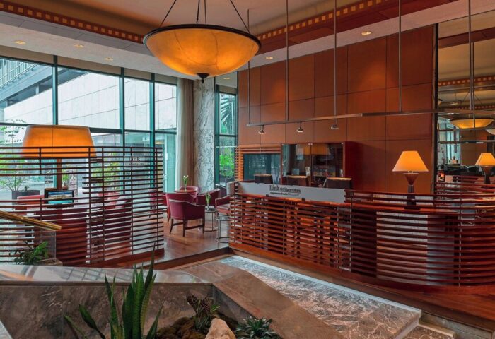 Sheraton Mexico City Maria Isabel Hotel lobby. Gay-friendly hotel with modern design, wood accents, and comfortable seating. Ideal for gay travelers.