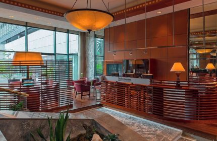 Sheraton Mexico City Maria Isabel Hotel lobby. Gay-friendly hotel with modern design, wood accents, and comfortable seating. Ideal for gay travelers.