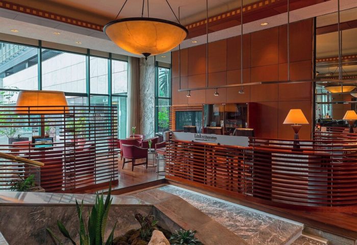 Sheraton Mexico City Maria Isabel Hotel lobby. Gay-friendly hotel with modern design, wood accents, and comfortable seating. Ideal for gay travelers.