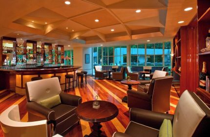 Sheraton Mexico City Maria Isabel Hotel bar. Gay-friendly hotel lounge area with bar, seating, and wood floors. Mexico City travel.