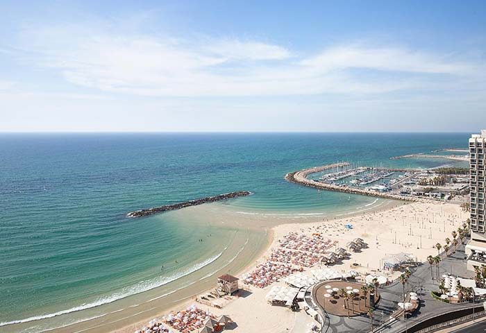 Gay-friendly Sheraton Tel Aviv Hotel view. Beach, marina, and sea. A pet-friendly hotel for gay men's travel advice in Tel Aviv.