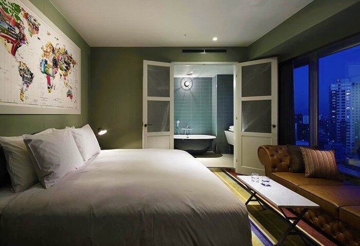 Shinjuku Granbell Hotel's gay-friendly room: bed, bath, and city view. Modern design for LGBT travelers. Enjoy your stay in Tokyo, Japan.