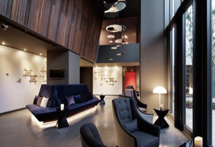Shinjuku Granbell Hotel's stylish lobby. A gay-friendly hotel in Shinjuku, Tokyo, with modern design, comfortable seating, and a welcoming atmosphere.