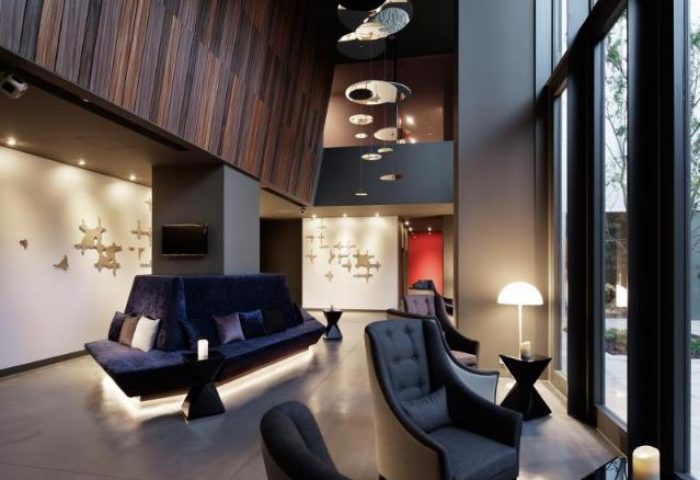 Shinjuku Granbell Hotel's stylish lobby. A gay-friendly hotel in Shinjuku, Tokyo, with modern design, comfortable seating, and a welcoming atmosphere.