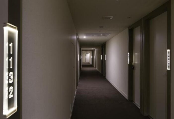Hallway at Shinjuku Granbell Hotel, a gay-friendly hotel. Room numbers are illuminated. Modern design, comfortable stay in Shinjuku, Tokyo.