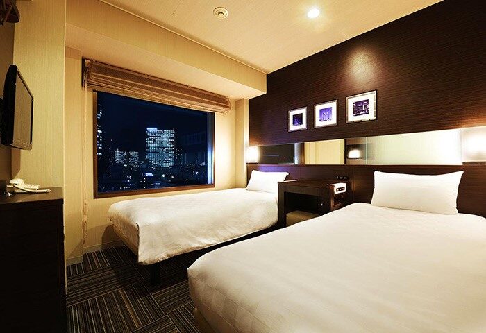 Shinjuku Prince Hotel room with twin beds and city view. Gay-friendly hotel in Shinjuku, Tokyo, Japan. Modern interior design.