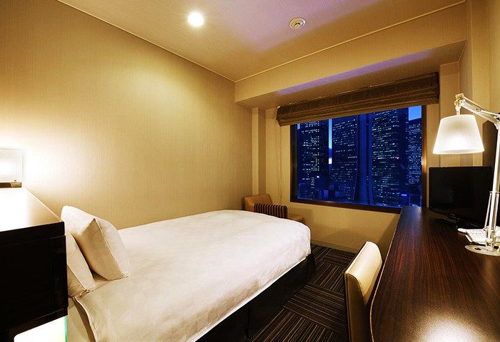 Gay-friendly Shinjuku Prince Hotel room. Single bed, desk, and city view. A comfortable stay in Tokyo for gay travelers.