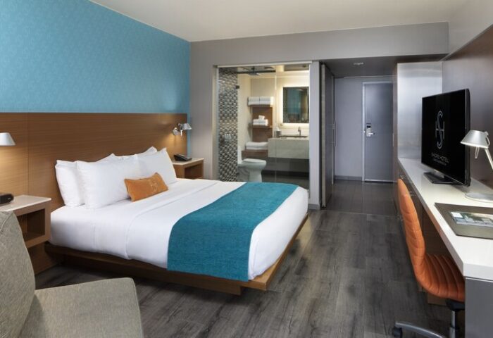 Shore Hotel gay-friendly room. Modern design with a king bed, desk, & bathroom. Perfect for gay travelers seeking comfort and style.