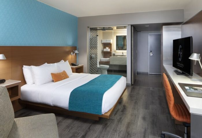 Shore Hotel gay-friendly room. Modern design with a king bed, desk, & bathroom. Perfect for gay travelers seeking comfort and style.