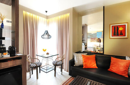 Siam @ Siam Design Hotel Bangkok room. Gay-friendly hotel interior with table, chairs, & sofa. Modern design in a Bangkok hotel.