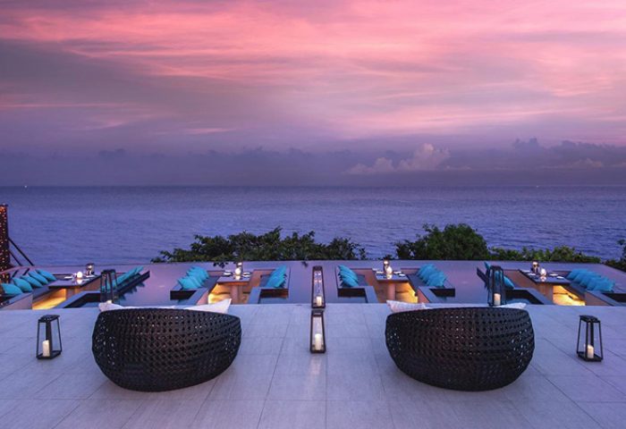Silavadee Pool Spa Resort gay-friendly hotel view. Outdoor dining with ocean sunset. Luxury travel for gay men. Romantic resort.